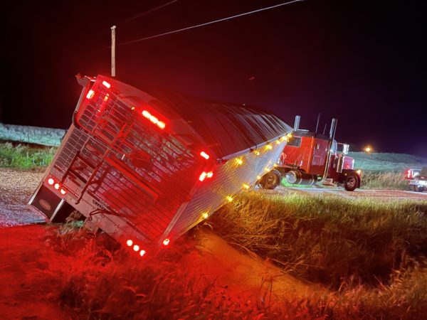 A truck sliding into a steep ditch.