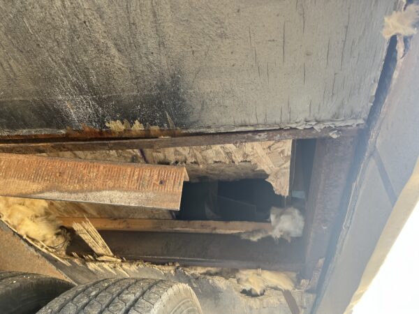 From the underside of the camper where the tire blew a hole in the floor. 